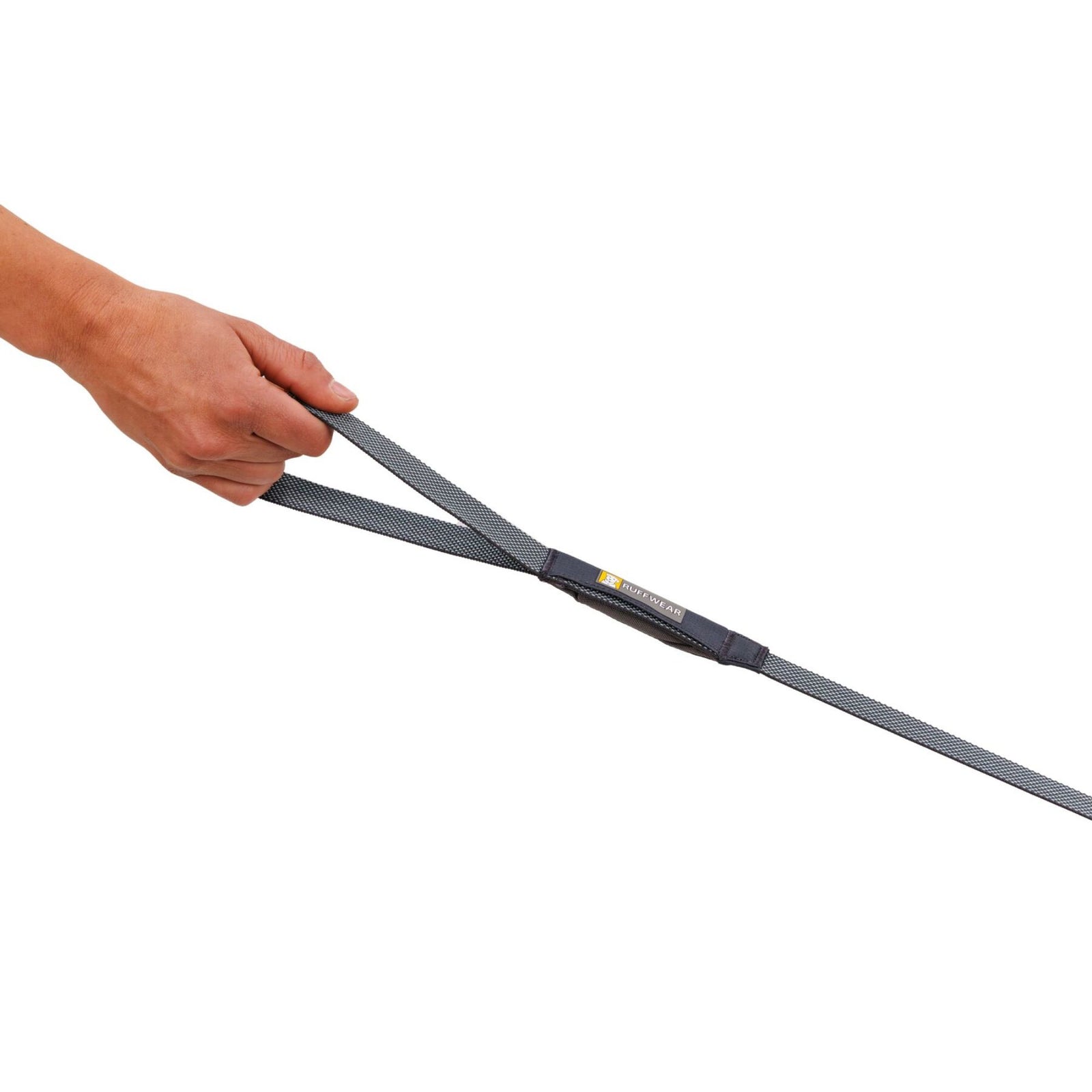 Close-up of a hand holding the Ruffwear Hi & Light Dog Lead in Basalt Gray, showing the minimal webbing and handle