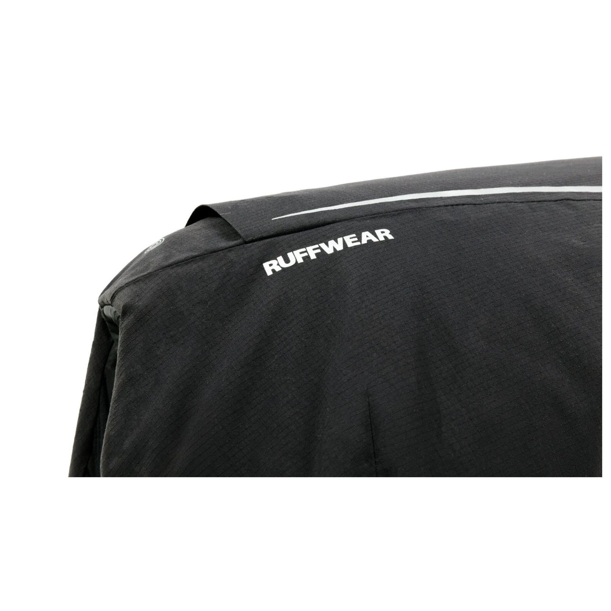 Ruffwear Powder Hound Waterproof Insulated Coverall in Obsidian Black - close-up of the tail area showing the tail cinch, reflective strip, and Ruffwear wordmark on the rear panel.